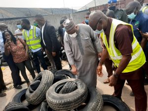R-L: SON Director, Inspectorate and Compliance Department,  Eng Obiora Manafa and the Director General of SON,  Farouk Salim inspecting substandard tyres in Lagos on Monday 