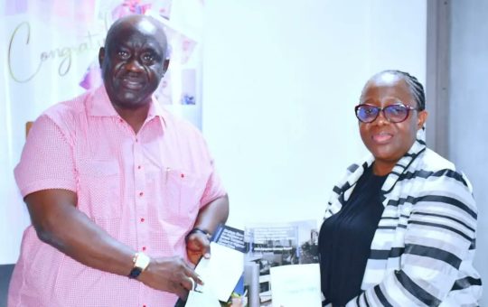 Minister of State for Transportation, Ademola Adegoroye (left) receiving the CNG Report from the Permanent Secretary of the ministry, Dr Magdalene Ajani on Tuesday in Abuja.