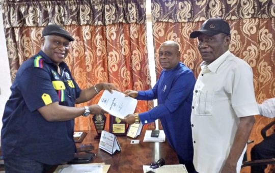 Chairman of Lagos State Wharf Landing Fee Collecting Authority, Hon Adegboyega Salvador (left) presenting the official gazettes and relevant laws backing the agency to President of IMAN, Chief Kingsley Chikezie while the Deputy Chairman South West of IMAN, Chief Austin Kelly looks on when IMAN visited the authority in Apapa Lagos on Monday