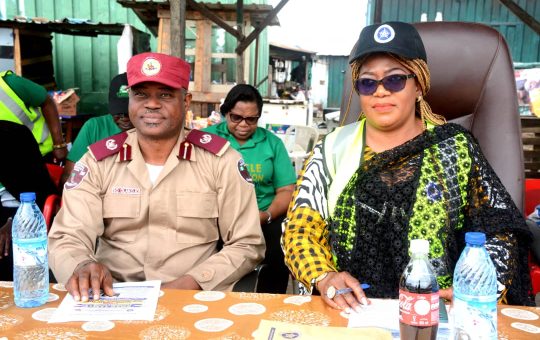 National Publicity Secretary of CIOTA, Mrs Chizoba Anyika (right) representative of the Federal Roads Safety Corps, Lagos State Command Commander O. C Olakoju at the CIOTA road safety campaign at Ojota Lagos