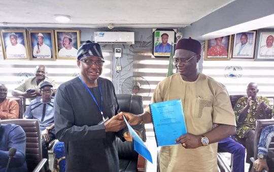 Comrade Adewale Adeyanju, President General of MWUN (right) and Chief Adekunle Oyinloye, Managing Director of Ideation Properties Development Limited at the signing of a JVA with the union in Lagos