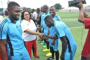 Chairman, Seaport Terminal Operators Association of Nigeria (STOAN), Princess Vicky Haastrup exchanging pleasantries with the players of Higher Pacific International (HPI) at the flag off of the 2022 Ships & Ports Maritime Cup Competition in Surulere, Lagos, on Tuesday.