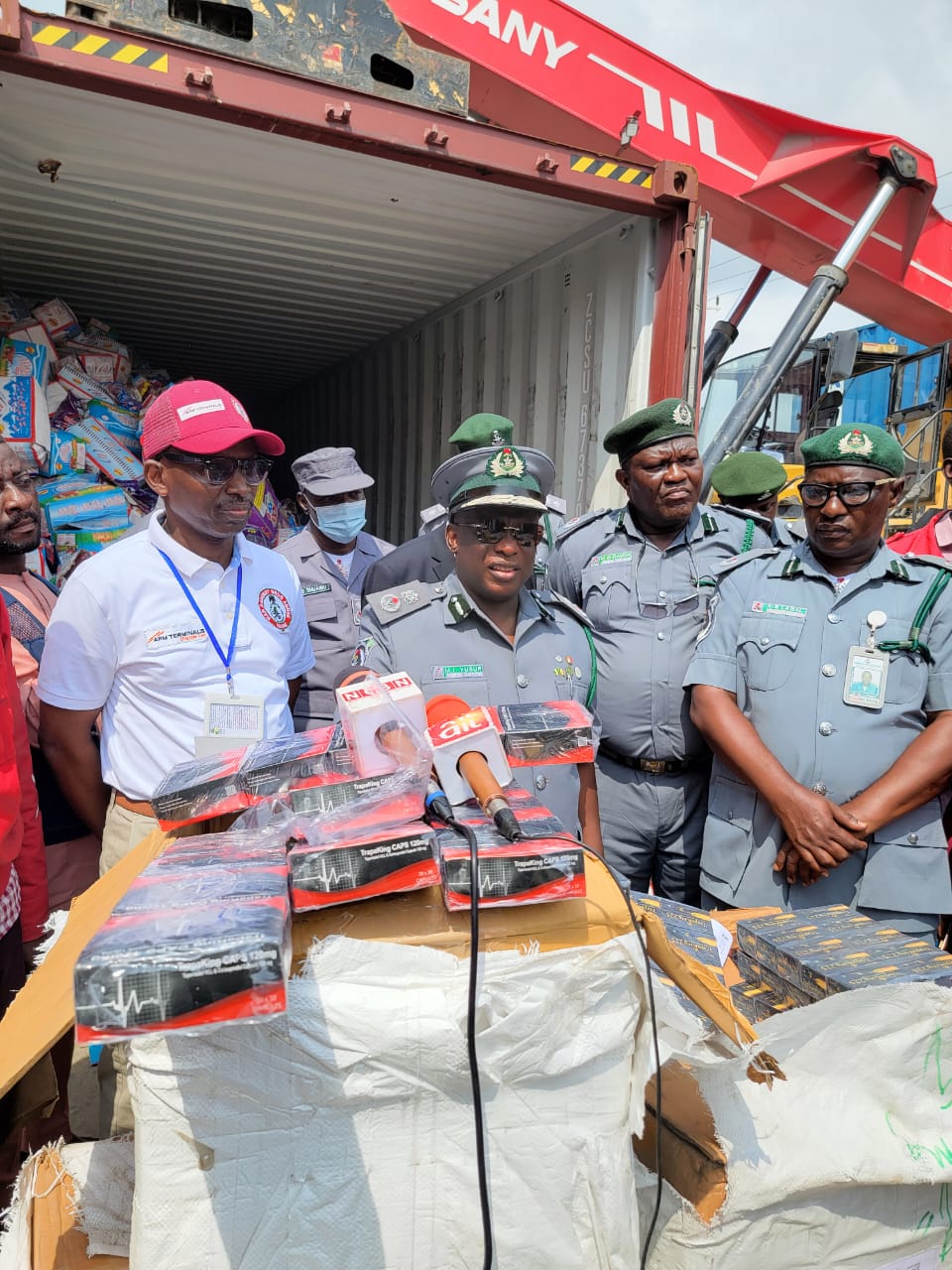 From left: Commander of NDLEA Apapa, Ishiaku Yusuf Kwajaffa, Customs Area Controller Apapa Command, Comptroller Yusuf Ibrahim Malanta and other senior customs and NDLEA officers showcasing the container of tramadol drugs in Classic Bonded Terminal