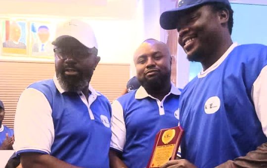 Managing Director of Kiti Energy Consulting Limited, Mr James Kitiya presenting an award of BEST MEDIA OF THE YEAR to the Publisher of Daily Trend Media Network Limited, Mr Dapo Olawuni while Mr Victor Enegide looks on at an event to launch Kiti Energy Logistics in Apapa Lagos on Monday, 1st of May 2023
