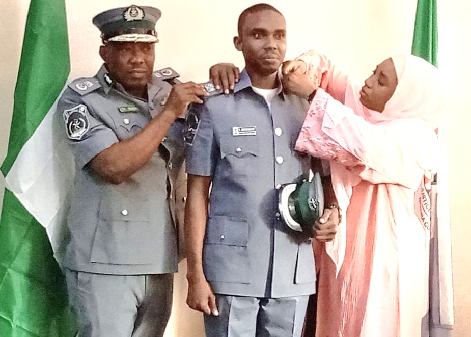 L-R: Comptroller Nnadi, Superintendent of Customs Abdulsamad Abdulbasit and Mrs Abdulbasit during the decoration ceremony in Lagos on Tuesday