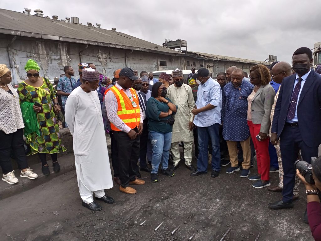 Eng Sambo inspecting dilapidated portion of the Apapa port bridge at Leventis Bus stop on Friday