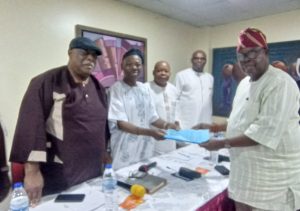 R-L: The Chairman of Nigerian Indigenous Ship-owners Association (NISA) Reconciliation Committee, Prince Olayiwola Shittu submits the Committee’s report to the Chairman of NISA BoT, Chief Isaac Jolapomo; while the Chairman, NISA Steering Committee, Sir Sonny Omatseye (left) and other members look on.