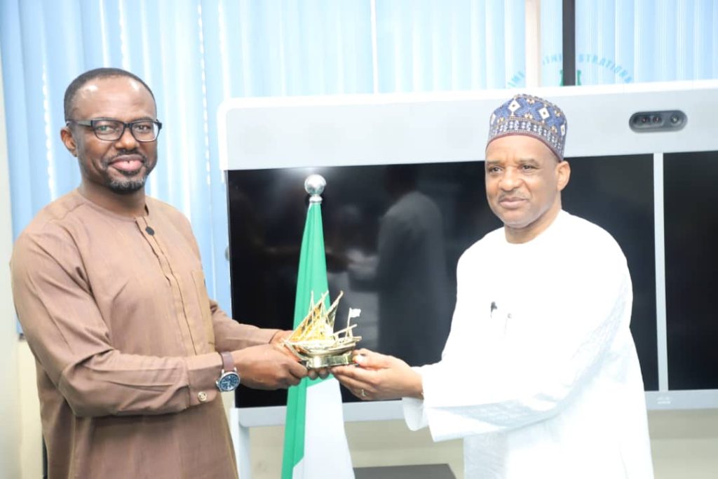 L-R: Director, Compliance Monitoring and Enforcement of Nigerian Communications Commission (NCC), Efosa Idehen receiving a souvenir from the Director General, Nigerian Maritime Administration and Safety Agency (NIMASA); Dr. Bashir Jamoh, OFR during a meeting between both Agencies to close ranks on submarine regulation in Nigeria, at the Head Office of NIMASA in Lagos.