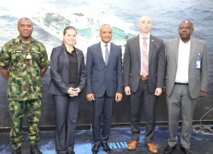 L-R: Commander, Maritime Guard Command, Nigerian Maritime Administration and Safety Agency, NIMASA, Commodore AA Gaya; leader of the delegation from the United States Coast Guard Lt. Cdr. Jonna L. Clouse; Director General, NIMASA, Dr. Bashir Jamoh, OFR; Cdr. James Cepa; Jordan Lachance, Political/Economic Officer, United States Consulate General, Lagos and Head, ISPS Unit, NIMASA, Mr. Isa Mudi. During a visit to the headquarters of NIMASA by the team from USCG and assessment of some Ports facilities in Nigeria