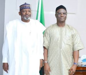 Minister of Transportation, Muazu Jaji Sambo (left) and the President General of Maritime Workers Union of Nigeria (MWUN) Comrade Adewale Adeyanju