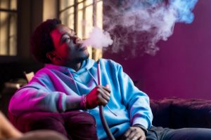 man-vaping-from-hookah-indoors-2